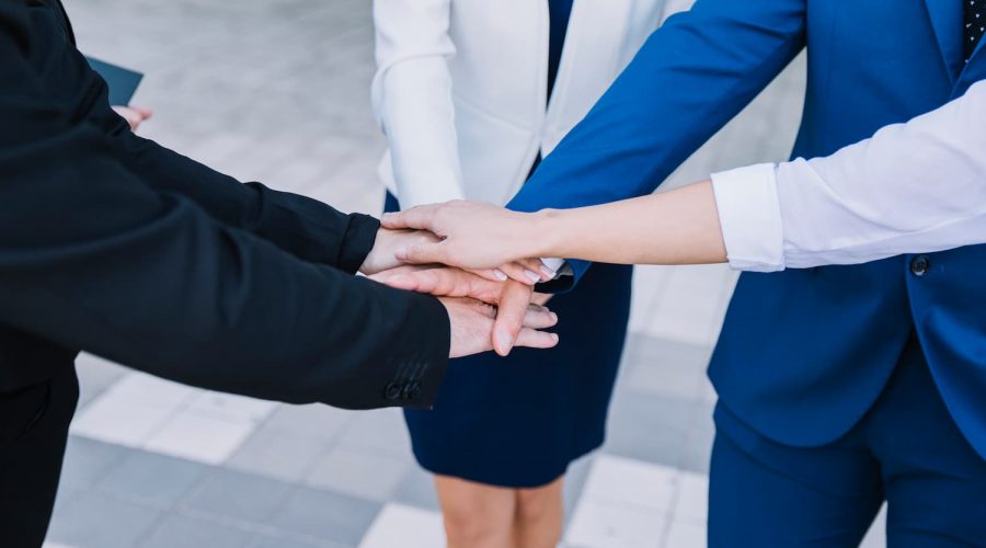 business-people-stacking-hands (1)